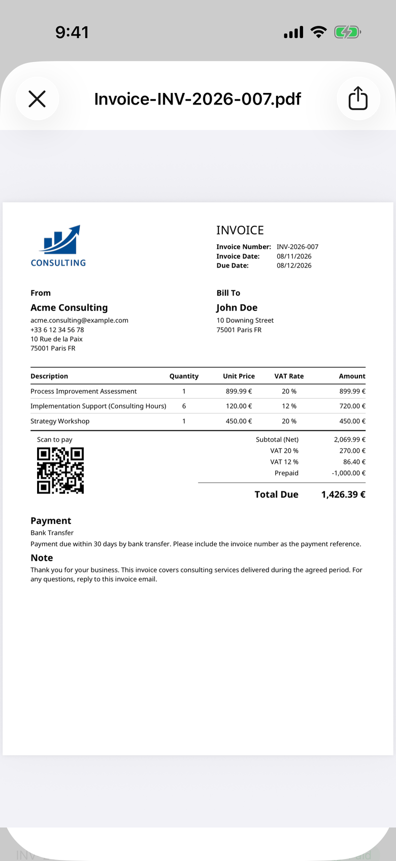 A finished PDF invoice on an iPhone showing a company logo, line items with separate VAT rates, a scan-to-pay QR code and the total due.